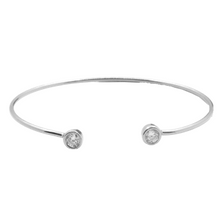 Load image into Gallery viewer, This 925 sterling silver cuff bangle is the perfect complement to any outfit. Can be worn stacked or on its own.  High quality cubic zirconia on each side of bangle.  Rhodium plated  Lead, nickel free, tarnish resistant  58mm circumference 

