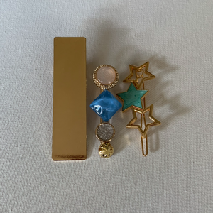 Style your hair with these beautiful trio of pearl clips. It is the perfect accessory to any outfit! Large plain clip in gold; star barrette in gold and teal; and a champagne with blue clip. Can be worn each as a single clip or pin or stacked together. You can also mix and match with another favourite clip of yours!  Three pieces