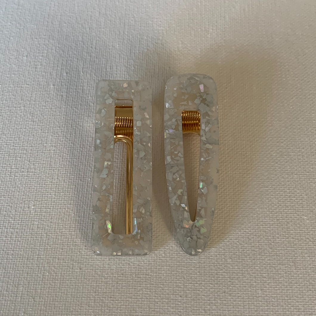 Style your hair with these beautiful duo clips. It is the perfect accessory to any outfit! Both clips are a beautiful opal colour. Can be worn each as a single clip or together. You can also mix and match with another favourite clip of yours!  Two clips 