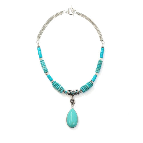 This handcrafted genuine turquoise choker is part of our Turquoise Collection. Turquoise howlite is a great stone to reduce anxiety, tensions, stress and anger, it is gentle, soothing and calms the energy around you.  The turquoise pendant and fittings are white gold plated.  The 16 inch chain is rhodium plated.  This choker is hypoallergenic, lead and nickel free and tarnish resistant.  Designed and handcrafted by Canadian artisan