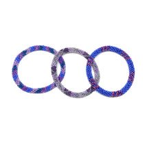 Load image into Gallery viewer, These &quot;Grape Popsicle Roll Ons&quot; come as a set of three.  They are handmade with love by women artisans in Nepal, using high quality glass beads and hand-dyed cotton thread. These bracelets will expand over your hand to fit most wrist.   The purchase of these bracelets empowers female artisans through fair trade. Your purchase provides women with fair income + benefits in a safe and healthy work environment. Aid Through Trade empowers women by creating opportunity through beautifully designed jewelry.
