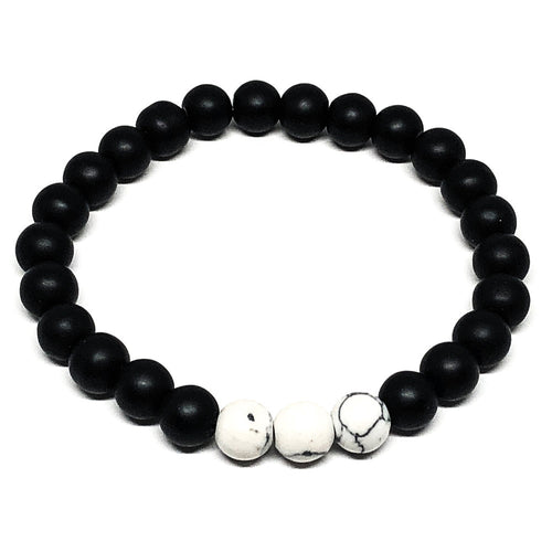 Perfect bracelet for those who love black and white.  Black agate is a grounding and protective crystal. It gives a calming peace that helps those in periods of stress. Howlite is also a calming stone. It is used when needing to reduce anxiety, tensions and stress.  Black agate and white howlite are perfect stones together.  Size fits M-L   8mm Black Agate Matte Beads   8mm White Howlite Beads 