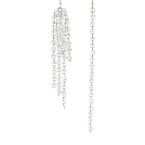 These asymmetrical crystal earrings can be worn with a bridal gown or for an evening out. Size: 9 cm and 11 cm  These earrings are rhodium plated.  Lead, nickel and cadmium free  Crystal, Rhinestones