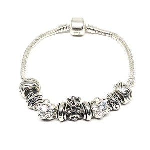 These summer pandora type bracelets are white gold plated.   The bracelet has Czech crystals and cubic zirconia.   Lead, nickel free and tarnish resistant.   The bracelet is 7 inches in length.   White gold plated  Czech Crystals   Cubic Zirconia   Designed and handcrafted by Canadian Artisan