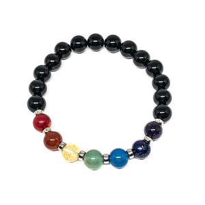 9 mm gemstones align to each Chakra, each is seperated by a tiny silver coloured bead. The Chakra beads consist of red coral, carnelian, treated citrine, green aventurine, blue quartz, lapis lazuli and amethyst. This stretchable bracelet is accented with black onyx beads.Includes:  1 bracelet, 18 cm in circumference with stretch cord, 9 mm beads
