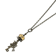 Load image into Gallery viewer, This Metal Key Necklace features a large, Light Colorado Topaz-colored, 18×12 mm Swarovski crystal rondelle with a ring of antique bronze-colored key charms.  This necklace is adjustable to approximately 32&quot; in length  Hypoallergenic  Pendant is 6cm x 2cm
