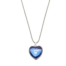 Load image into Gallery viewer, Tanzanite aura quartz is the end result of a process which uses intense heat to infuse gold and indium to natural quartz. The atoms fuse to the crystal&#39;s surface, which gives it an iridescent metallic sheen on a purple crystal. This beautiful genuine tanzanite aura heart necklace comes with a 24 inch ball chain.    Lead, nickel free 
