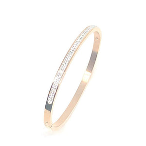 This stunning swarovski crystal bangle is made of surgical stainless steel.  It can be worn with your evening outfit or dress up your jeans and shirt with this beautiful bangle.   This bangle is rose gold plated   The bangle is lead, nickel free and hypoallergenic   Has 2 rows of beautiful clear swarovski crystal 
