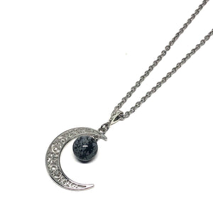 Genuine snowflake obsidian stone  Hypo-allergenic stainless steel chain  This necklace is adjustable to approximately 32" in length