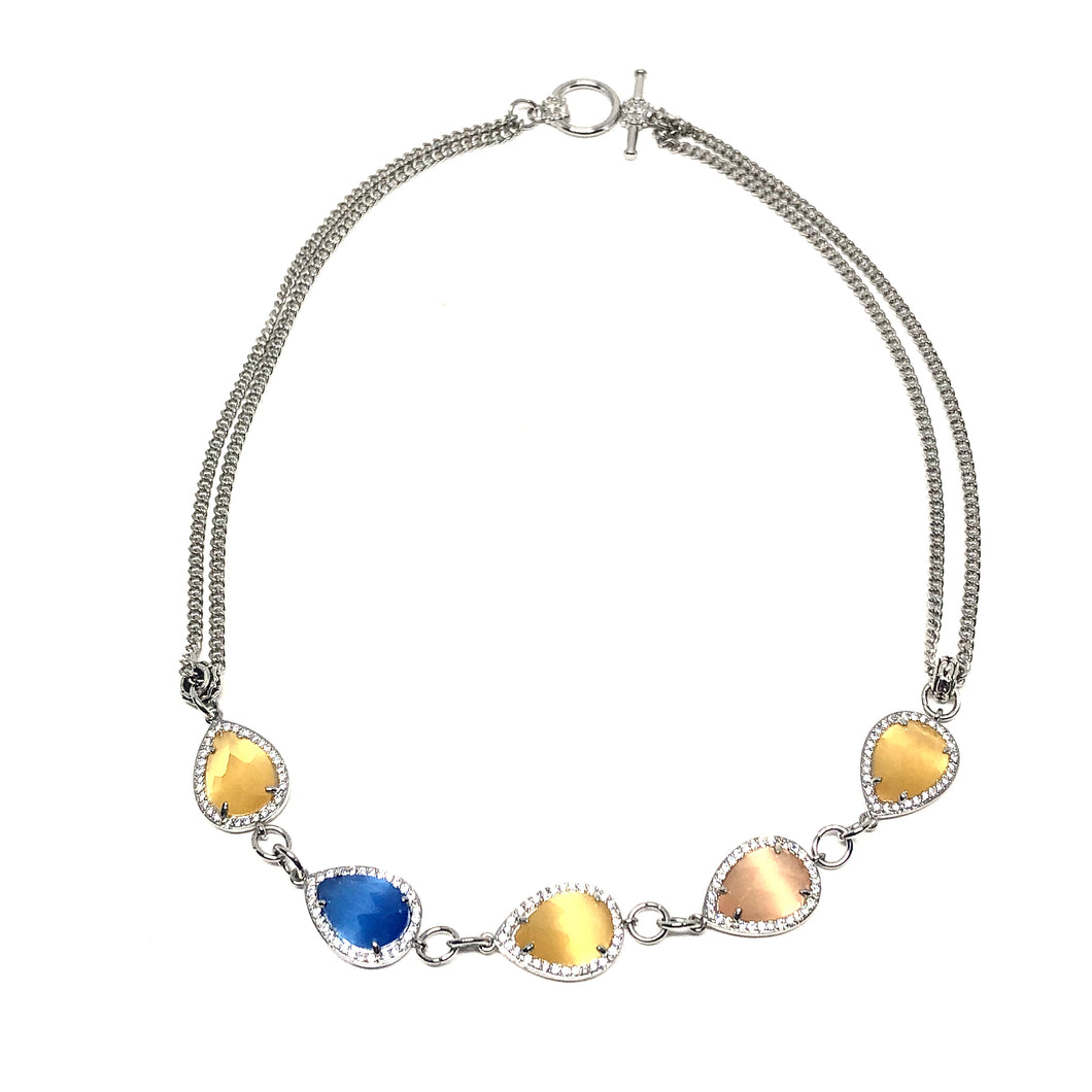 This beautiful short necklace has Blue Agate, Yellow Agate crystals surrounded by beautiful Czech crystals.  The length of this necklace is 16 inches  Chain is rhodium plated  Designed and handcrafted by Canadian artisan