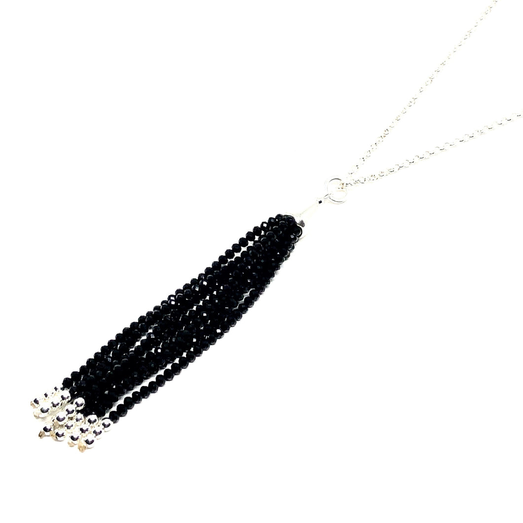 Discover eye-catching, straight-off-the-runway inspired pieces. One statement piece, infinite possibilities…  Merx Modern is exclusively designed and handmade in Canada.  This necklace has black crystal tassels on a silver chain   This necklace length is 30” + 2” extender & clasp  Tassel hangs down 4.5”