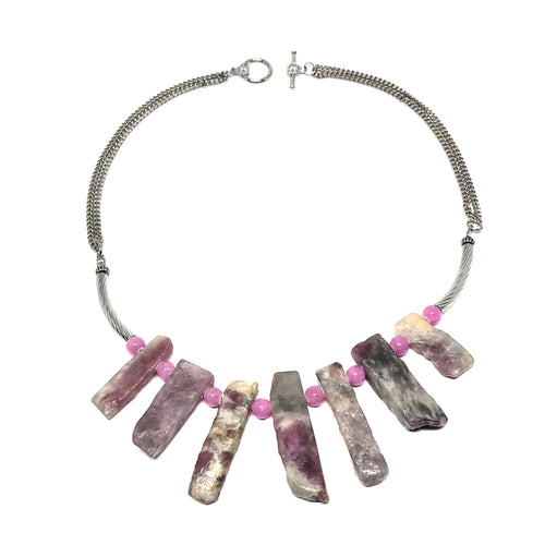 This necklace is designed with created using genuine pink tourmaline and rose quartz stones.  Genuine Rose Quartz are placed between the pink tourmaline stones.  All finishings and charms are white gold plated.  This necklace is rhodium plated, lead and nickel free and tarnish resistant.  Color, cut and shape of stone may vary  This necklace is 17” in length with a toggle clasp