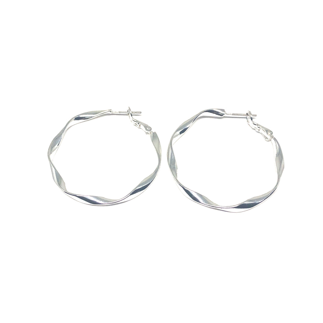 Exclusively designed and handmade in Spain, these eye-catching earrings are straight off the runways. Indulge in the high fashion experience when you accessorize your outfit with these statement pieces. Luminously sterling silver plated; comfortably ultra lightweight; accented to adorn any and every attire! Manufactured in compliance with the European Standards ― nickel and lead free.  Hypoallergenic   These hoop earrings are 40mm in size 