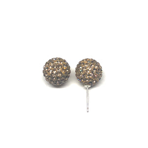 These genuine light topaz swarovski crystal studs are hand set in a clay base.  The post and backs are sterling silver   Hypoallergenic, lead and nickel free 