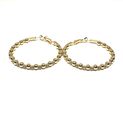 These sofistica gold and crystal 40mm hoop earrings make everyday dressing so much fun.  These hoops have crystals separating each ball.   Lead and nickel free   Hypoallergenic 