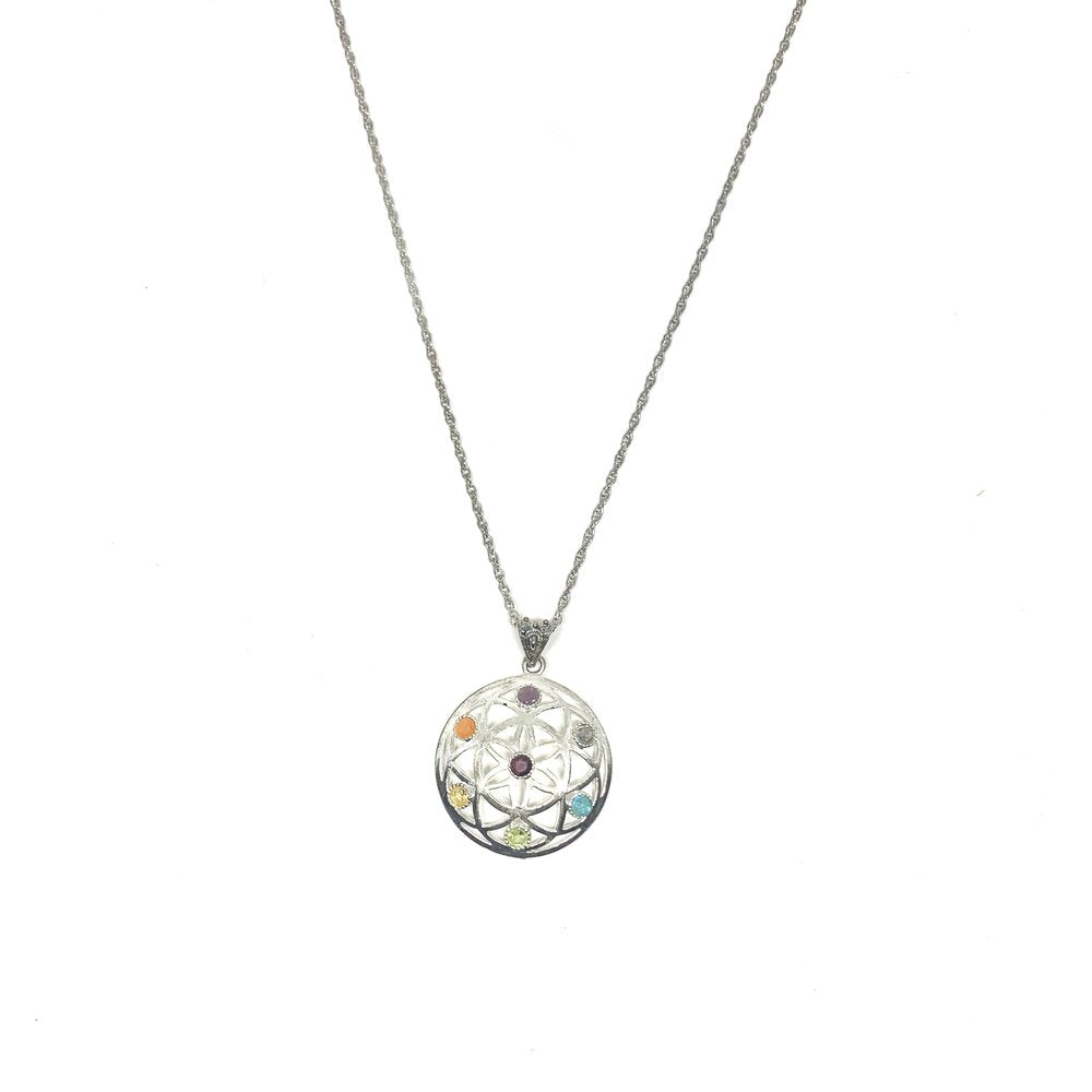 This eye catching silver coloured nikel free alloy pendant comes from India. Gemstones which represent the chakra system include garnet, light and dark treated citrine, peridot, aquamarine, iolite, amethyst and dark blue quartz.The length of this necklace is 34cm including the Seed of Life Pendant.  Seed of Life Pendant is 4cmx4cm