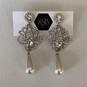 These crystal and pearl bridal earrings are all that you need to complement your beautiful bridal gown.   They are hypoallergenic, lead, nickel and cadmium free.  They contain high quality czech rhinestone and crystals  From top to bottom of earring is 7 cm in length 