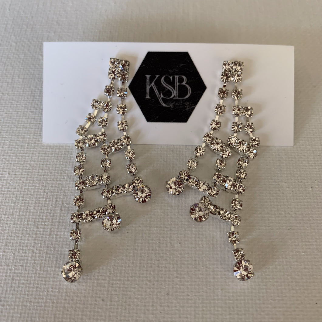 These elegant silver plated rhinestone earrings can be worn as bridal earrings or for a formal evening out.   Crystal Rhinestones  Silver Plated   Lead, nickel and cadmium free 