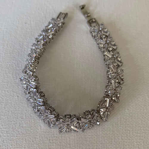 This cubic zirconia bracelet is the perfect accessory for your bridal gown or to wear with your favourite evening dress.  The cubic zirconia are high quality AAA+ and the bracelet is silver plated.   This bracelet is 18.2 cm in length.  Lead, nickel and cadmium free 