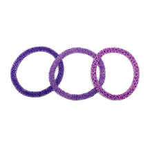Load image into Gallery viewer, These &quot;Plum Perfect Roll Ons&quot; come as a set of three.  They are handmade with love by women artisans in Nepal, using high quality glass beads and hand-dyed cotton thread. These bracelets will expand over your hand to fit most wrist.   The purchase of these bracelets empowers female artisans through fair trade. Your purchase provides women with fair income + benefits in a safe and healthy work environment. Aid Through Trade empowers women by creating opportunity through beautifully designed jewelry.
