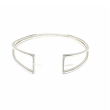 Load image into Gallery viewer, This 925 sterling silver cuff bangle is the perfect complement to any outfit. Can be worn stacked or on its own.  High quality cubic zirconia on each side of bangle.  Rhodium plated  Lead, nickel free, tarnish resistant
