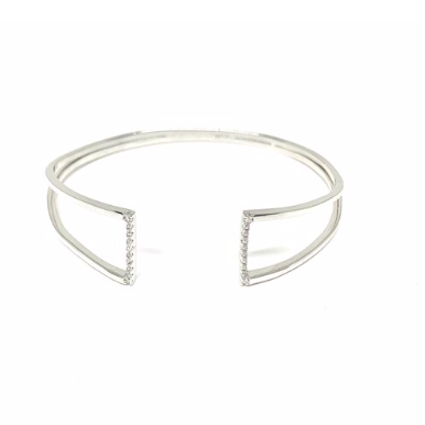 This 925 sterling silver cuff bangle is the perfect complement to any outfit. Can be worn stacked or on its own.  High quality cubic zirconia on each side of bangle.  Rhodium plated  Lead, nickel free, tarnish resistant