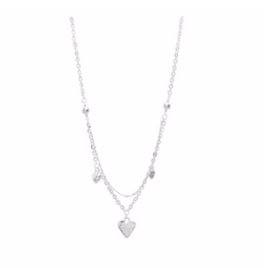 Discover eye-catching, straight-off-the-runway inspired pieces. One statement piece, infinite possibilities…  Merx Modern is exclusively designed and handmade in Canada.  This silver heart short necklace is layered and has silver hearts hanging around the necklace   This short layered is 20” + 2” extender & clasp