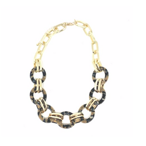 The fashion trend for tortoise jewelry continues and is very popular this year. This short necklace is a great option to pair up with a simple black dress or goes great with a v neck shirt.  This necklace is 16” + 3” extender