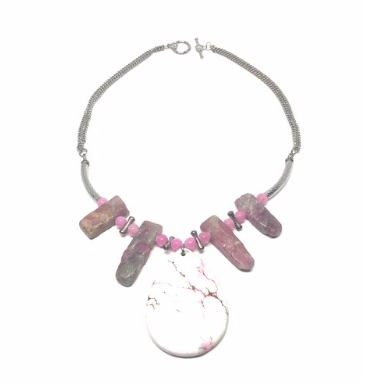 This necklace is handcrafted using genuine pink tourmaline and a genuine pink howlite pendant.  Both these stones together make the perfect necklace!  All finishings and charms are white gold plated.  This necklace is rhodium plated, lead and nickel free and tarnish resistant.  This necklace is 17” in length  Genuine Pink Howlite Pendant is 2” x 2”