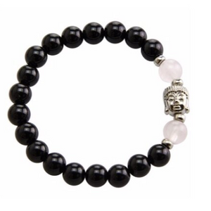 Stretchable bracelet with two rose quartz beads surrounding a Buddha charm. Accented with black onyx beads.As a healing stone, black onyx is thought to increase regeneration, happiness, intuition and instincts.  Includes:  1 bracelet, 18 cm in circumference with stretch cord, 9 mm beads