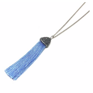 The tassel has almost always been a symbol of power and prestige.  This beautiful handcrafted tassel necklace is on a 27” rhodium plated chain.  This necklace has stunning genuine czech crystals and beautiful silk tassel. It is lead and nickel free and is tarnish resistant.  Designed and handcrafted by Canadian Artisan