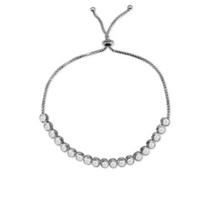 Load image into Gallery viewer, This feminine, light 925 sterling silver bracelet features one row of beautiful cubic zirconia on a sterling silver adjustable chain.   This bracelet is rhodium plated .   It can be worn as a single bracelet or stacked.  Because this bracelet is adjustable, it will fit most wrists  Hypoallergenic
