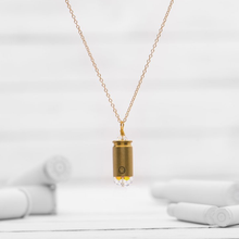 Load image into Gallery viewer, ﻿LAST ONE AVAILABLE!!   Our customers who have purchased this necklace get so many compliments. It is a beautiful necklace to wear!  Plated Brass chain (Long 33” Length)  7.62 Shell Casing  1 Genuine Austrian Swarovski Crystal
