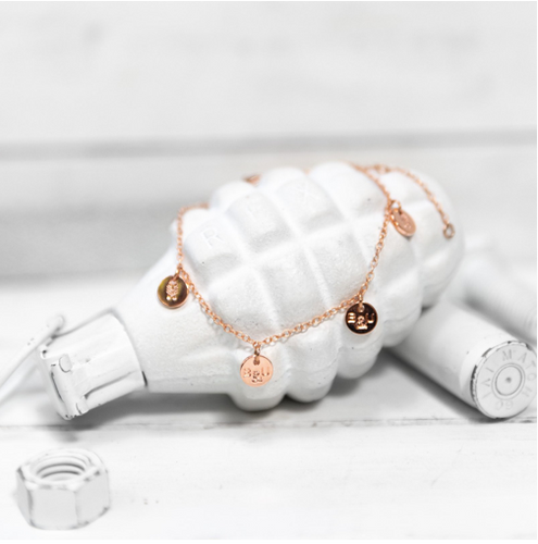 A classic multi-charm design that can be worn as a bracelet or an anklet. Each charm is stamped on both sides with B&U markings.  This bracelet is adjustable - one size fits most.   This 24K rose gold  plated stainless steel bracelet has a lobster clasp. 