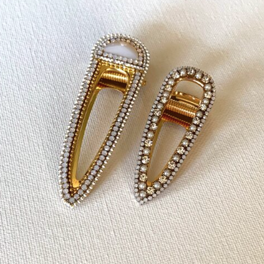 Style your hair with these beautiful duo rhinestone clips. It is the perfect accessory to any outfit! Large clip is opal in colour and smaller clip is opal with pearl & crystals. Can be worn each as a single clip or together. You can also mix and match with another favourite clip of yours!  Two pieces